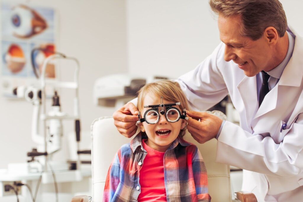 An optometrist assesses their patient's myopia progression during their routine eye exam.