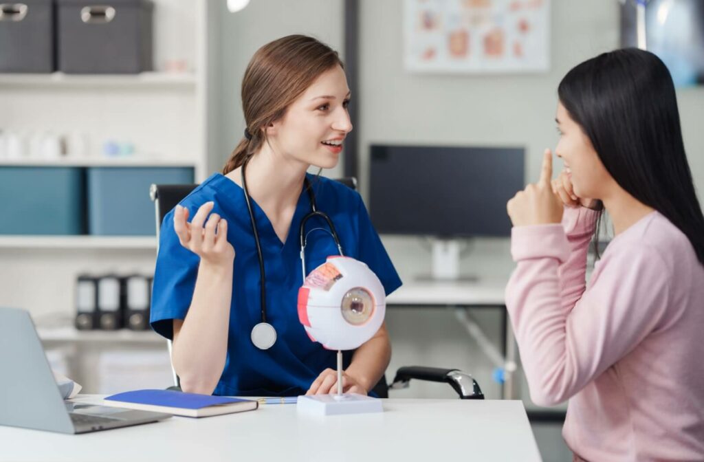 An optometrist reviews their patients medical history to help inform the tests they'll perform during the comprehensive eye examination.