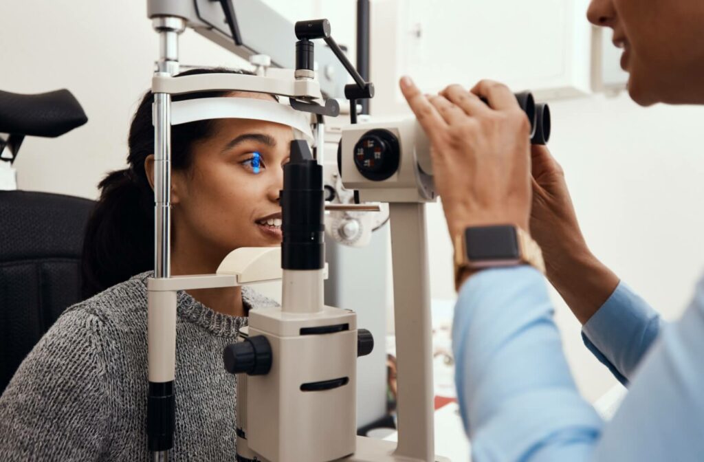 An optometrist uses a slit lamp to get a close look at the internal components of their patient's eye to rule out diabetic retinopathy.