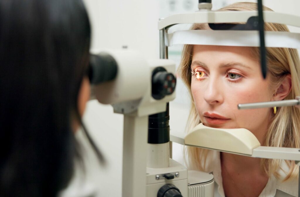 An optometrist uses a slit lamp to locate their patient's missing contact lens.
