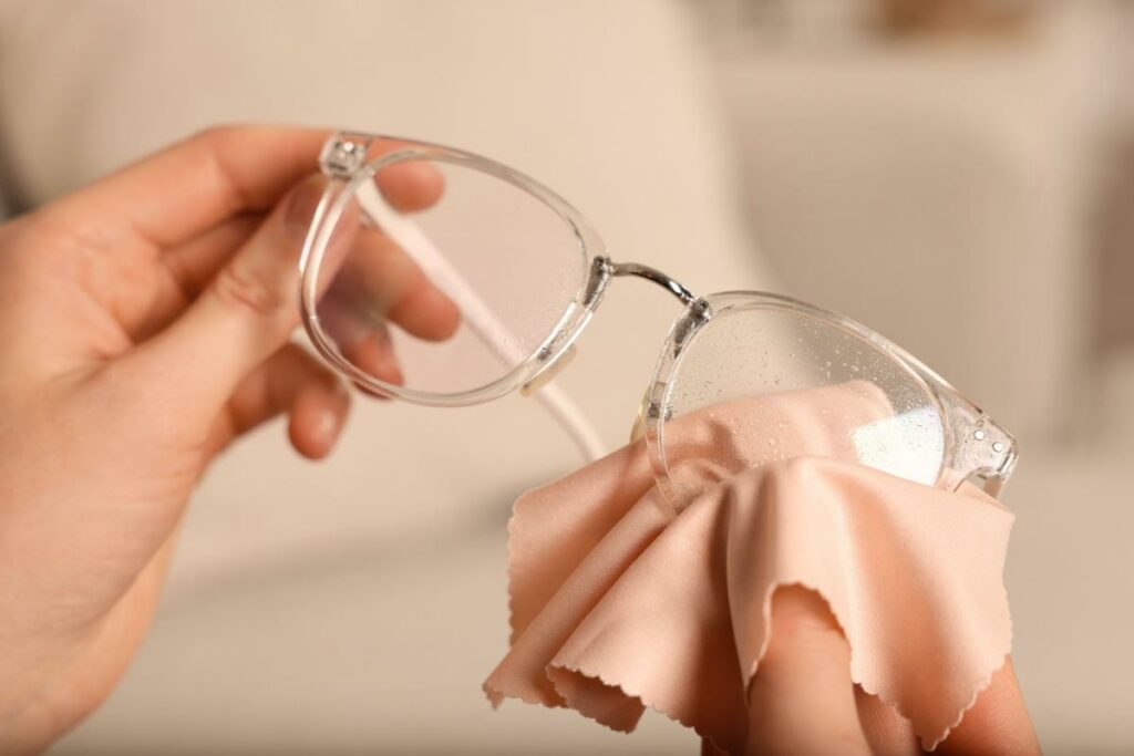 Glasses being cleaned with a cloth